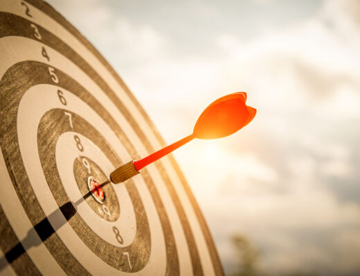 dart hitting the goal in the center of the target